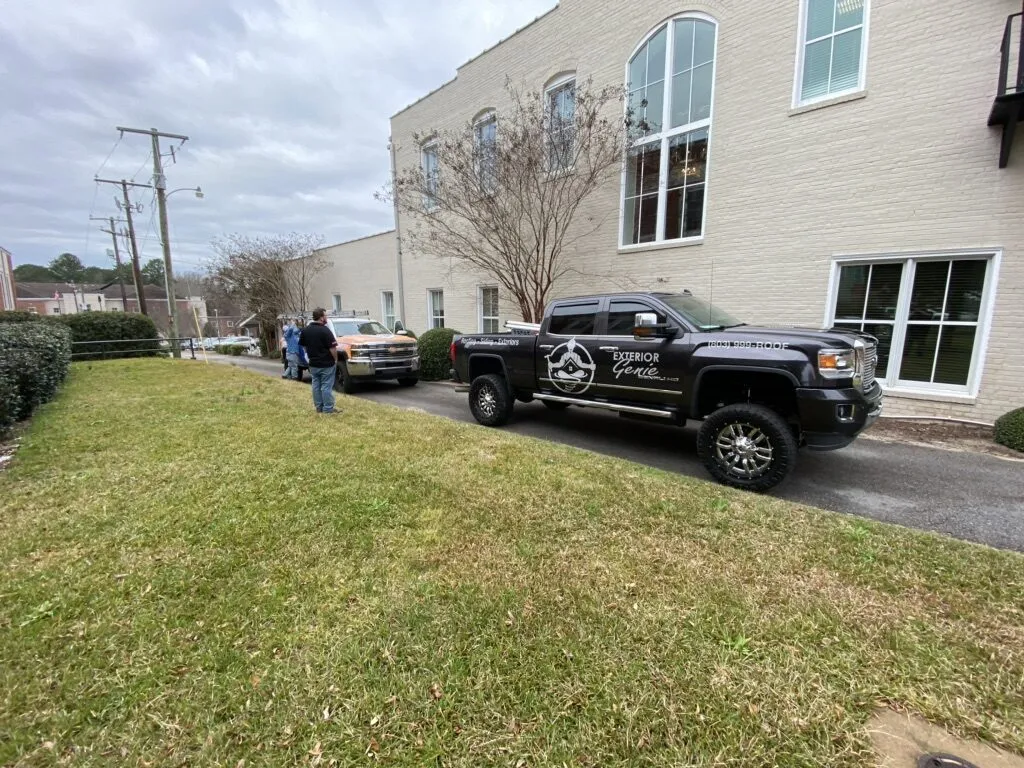 Exterior Genie crew and trucks on site at a commercial office building