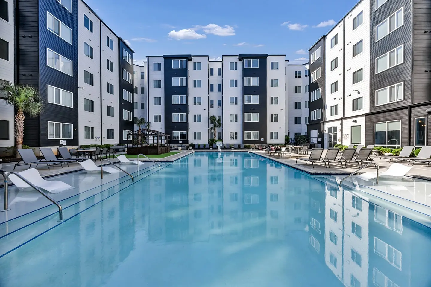 Completed resort-style pool courtyard amenity at a multi-family development