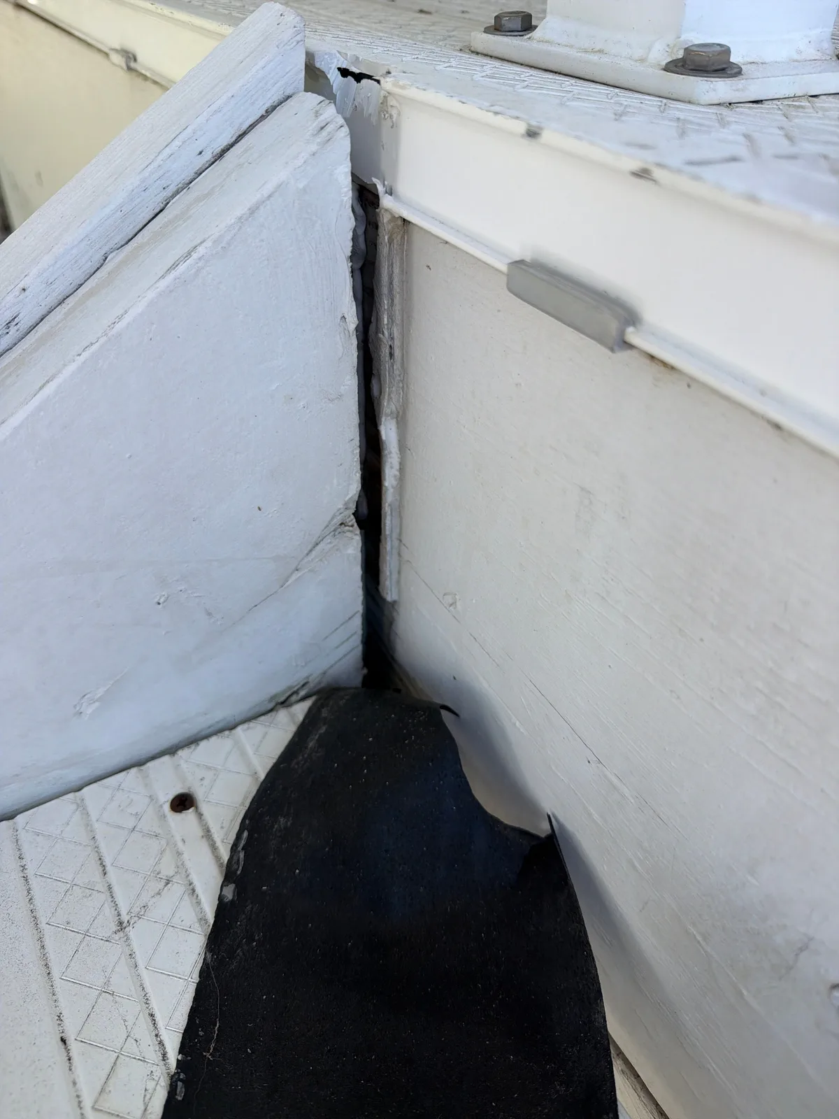 Gap where the stair stringer is pulling away from the landing